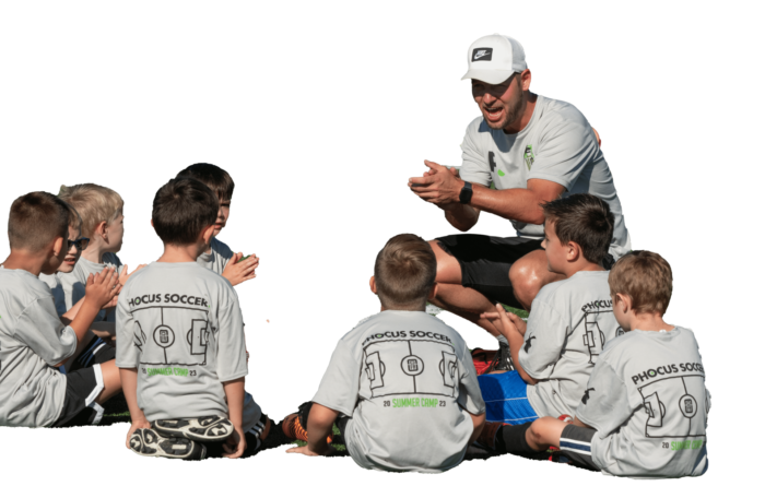Coach Sander motivating kids on a soccer camp